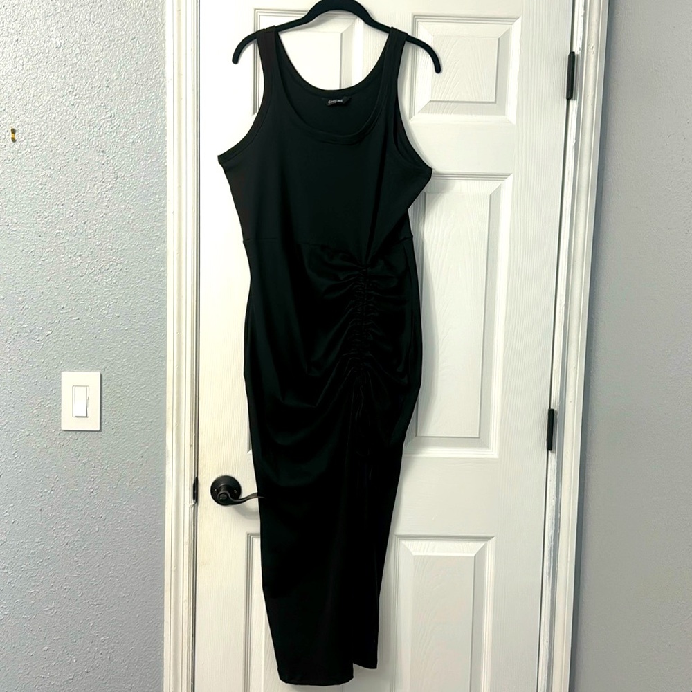 Long black rouched , dress with adjustable tie on front of dress.